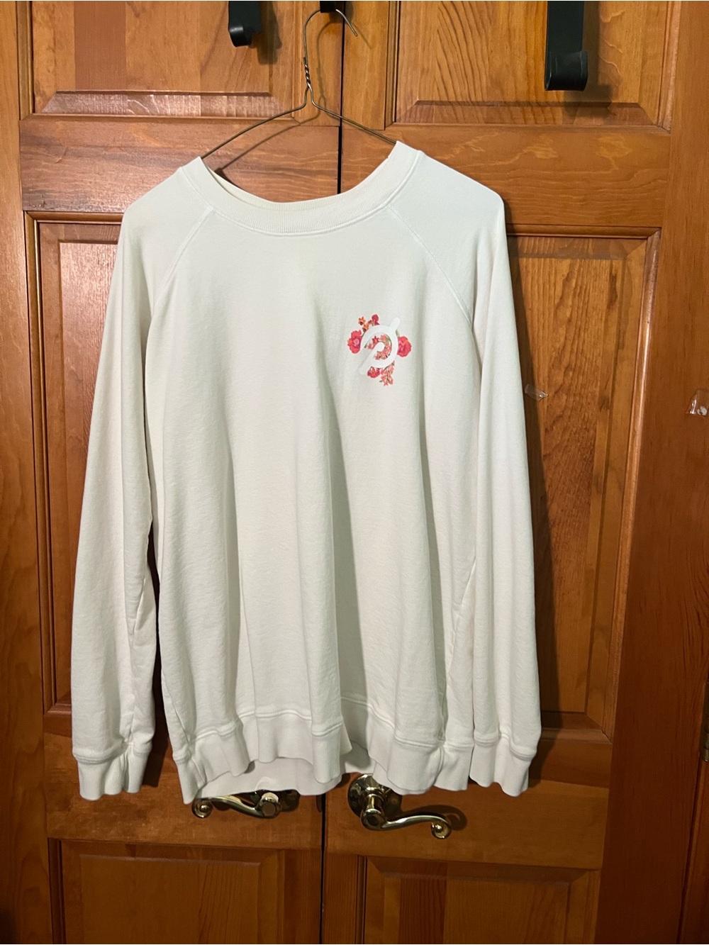 Peloton Cream Crewneck Sweatshirt with Pink Floral Logo